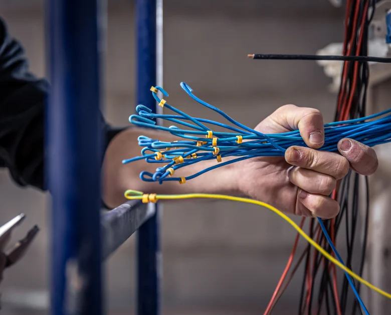Electrician working with electrical wiring
